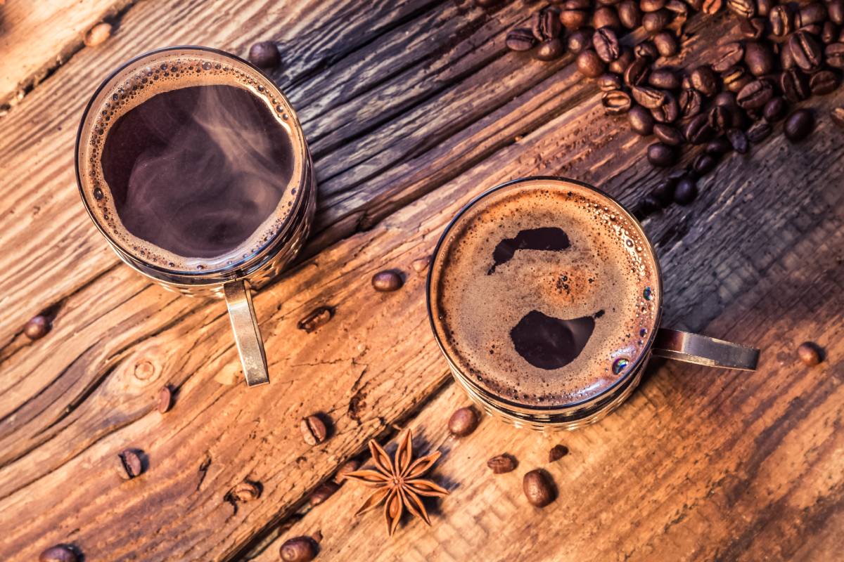 Closeup of hot coffee in old wooden table
