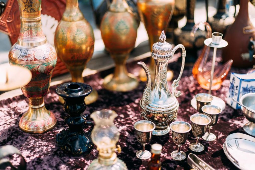 Metal Oriental Jug With Engraved Texture Floral Pattern. Oriental Style Ancient Jug At Flea Market. East Tableware. Old Tableware For Cofe And Tea.Metal Oriental Jug With Engraved Texture Floral Pattern. Oriental Style Ancient Jug At Flea Market. East Tableware. Old Tableware For Cofe And Tea.